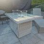 Beautiful, barely used, rattan fire pit table. Image 2