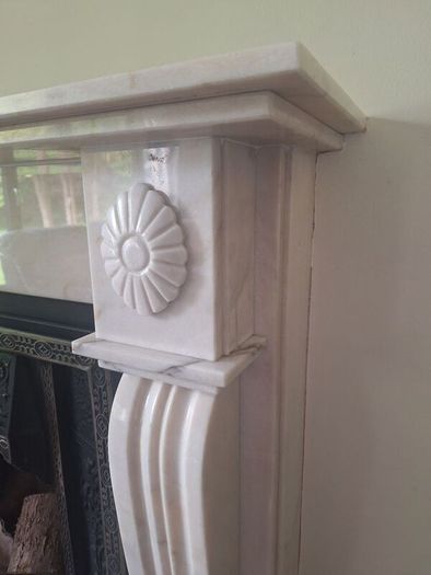 Castiron fireplace and surround plus marble mantlepiece and black stone heart