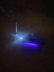 Nine bot e scooter with leds lights on the bottom of the frame. It's able to fold to make it easy to transport