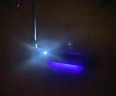 Nine bot e scooter with leds lights on the bottom of the frame. It's able to fold to make it easy to transport