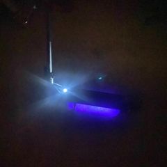 Nine bot e scooter with leds lights on the bottom of the frame. It's able to fold to make it easy to transport
