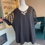 Ladies Black Short-sleeve Top Features Sheer polka-dot mesh sleeves Image 6