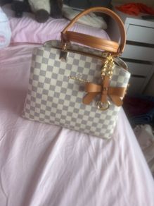 cream Louis Vuitton handbag