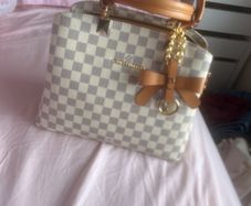 cream Louis Vuitton handbag