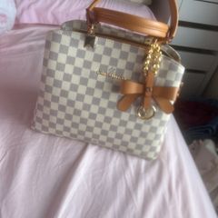 cream Louis Vuitton handbag