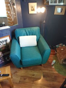 green armchair and reading light