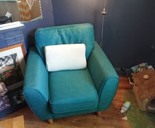 green armchair and reading light
