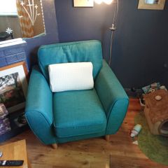 green armchair and reading light