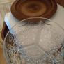 Nut dish in the holder is plastic have wood finished. Image 2