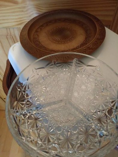 Nut dish in the holder is plastic have wood finished.