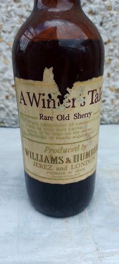 vintage bottle of winters tale sherry 3/4 full ,found in a old pub closed down,