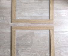 Original IKEA BESTA cabinet door/front panel in discontinued natural oak finish with clear glass centre.