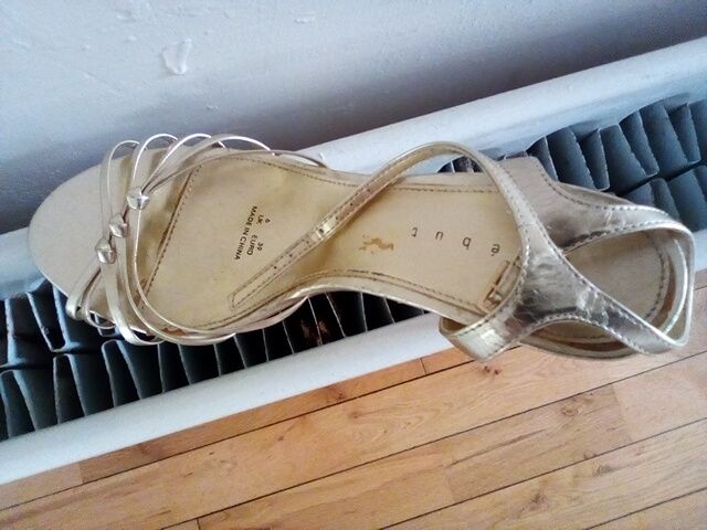 Gold strappy sandals/ shoes . Ideal for a wedding or night out . Size 6.In box