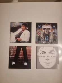 Four Michael Jackson CDs in paper Sleeves