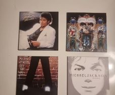 Four Michael Jackson CDs in paper Sleeves