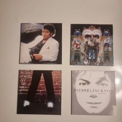 Four Michael Jackson CDs in paper Sleeves