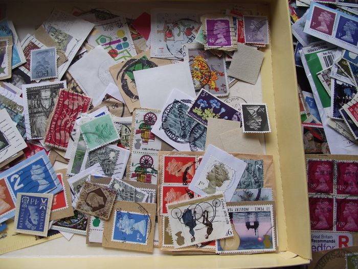 A box with collection of stamps from Great Britain