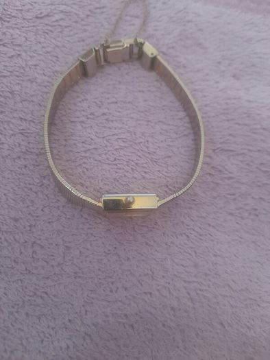 Gold plated ladies vintage citronella quartz wrist watch complete with safety chain