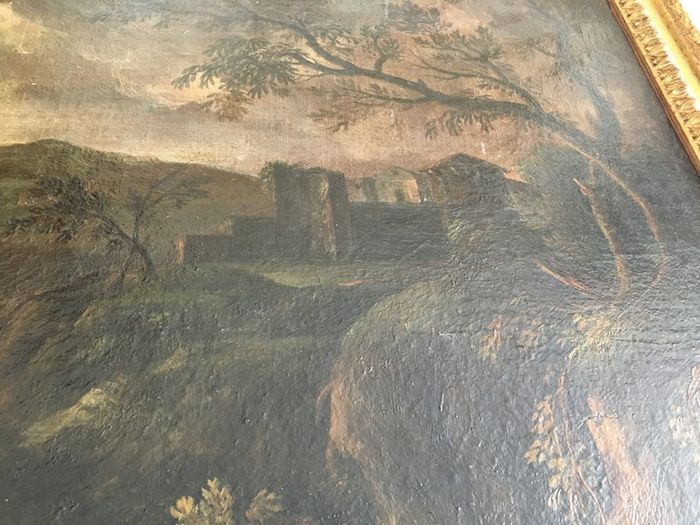 Circle of Francesco Zuccarelli  mountainous landscape by a lake with a fortress