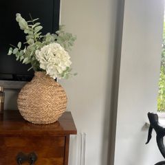 Rattan vase with artificial flowers