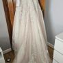Wedding dress. Size 12. Brand new. Stunning dress! Heavily beaded. Fabulous pink underlay. Image 2