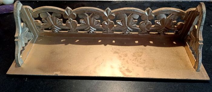 Carved wooden shelf