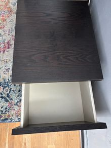 drawers in a black-brown wood veneer finish glass top