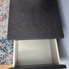 drawers in a black-brown wood veneer finish glass top