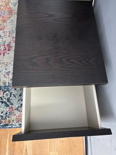 drawers in a black-brown wood veneer finish glass top
