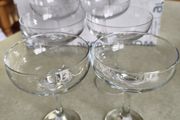 Set of 6 Champagne Glasses is set of    4 plain glass Champagne Glasses and set of 2 slight smaller plain glass Champagne Glasses over all they look nearly same