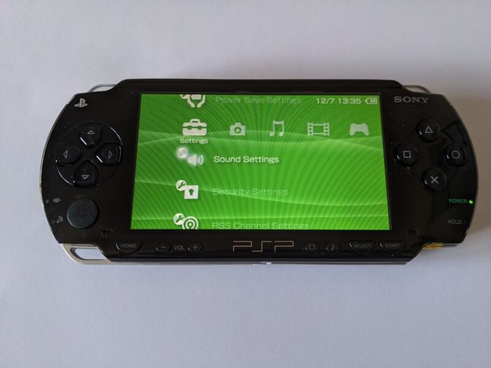PSP original console with charger and battery