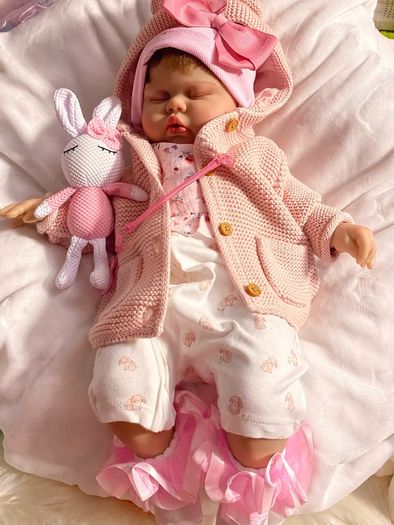doll.       Reborn baby doll very cute COMES WITH A XMAS OUTFIT