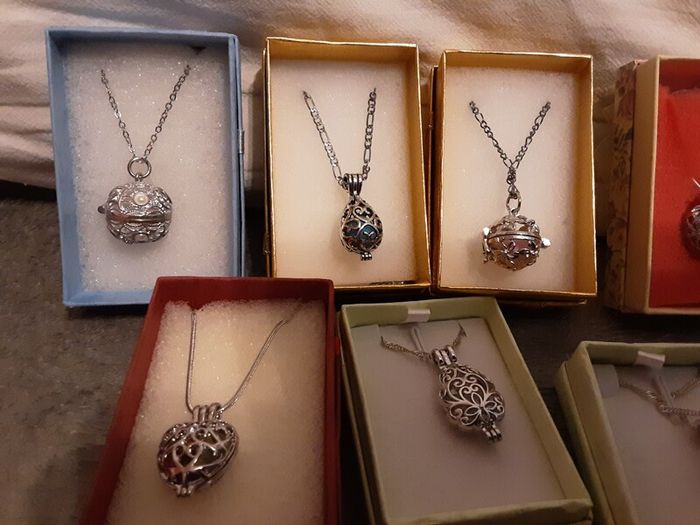 selection of homemade white metal necklaces