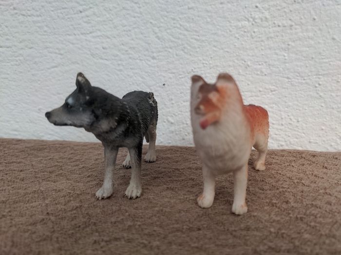 Two toy dog figures