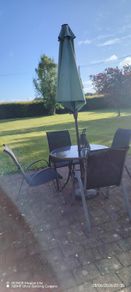 Glass table and 4 chairs. Can have umbrella and stand if want