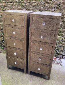 Embossed brass pair of tallboys