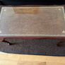 Vintage Queen Anne-style wooden coffee table featuring cabriole legs, a glass top protecting an inset leather surface with gold tooling Image 4