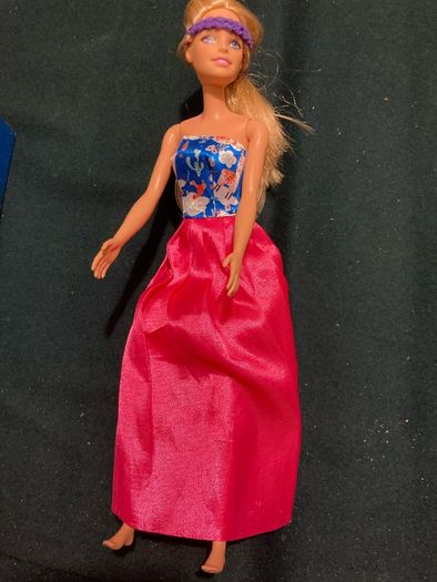 Two Barbie Dolls.