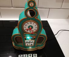 Grinch themed clock with radio and Bluetooth