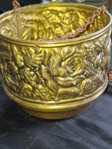 Vintage Brass Hanging Planter likely originates from England and features an embossed floral or rose pattern. The piece has developed a natural verdigris patina over time, postage available or collection