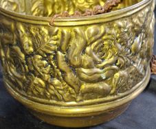Vintage Brass Hanging Planter likely originates from England and features an embossed floral or rose pattern. The piece has developed a natural verdigris patina over time, postage available or collection