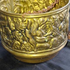 Vintage Brass Hanging Planter likely originates from England and features an embossed floral or rose pattern. The piece has developed a natural verdigris patina over time, postage available or collection