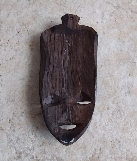 Handcarved Wooden Tribal Mask with Elephant Carving