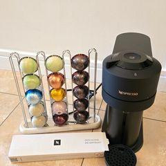Nespresso Vertuo Next coffee machine with capsule holder and pods to taste
