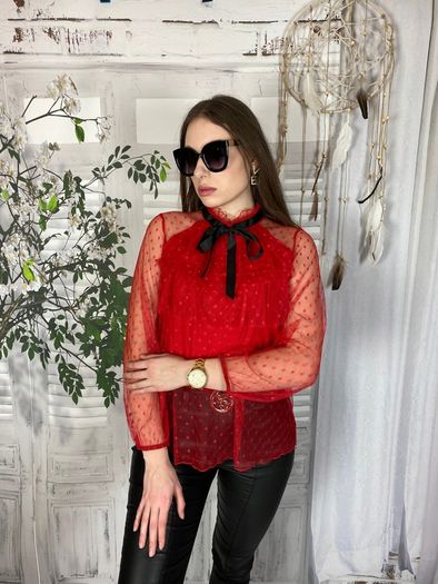 Lace blouse with a bow at the neck