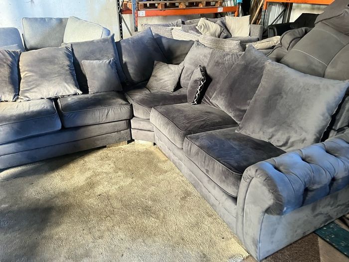 Grey corner sofa with scatter cushions