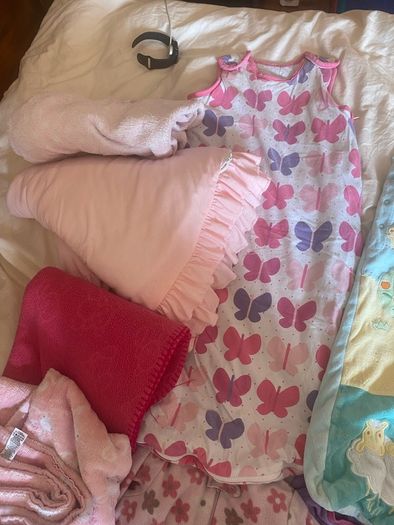 10 all in ones, 3 baby sleep bag, 4 pink blankets