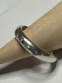 Handmade sterling silver ring with white CZ stones. Size M