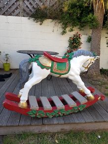 large Christmas rocking horse on a bow
