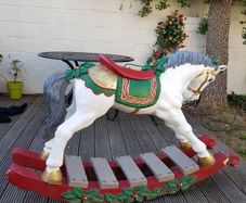 large Christmas rocking horse on a bow